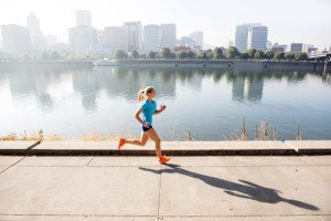 A young girl running for exercise.